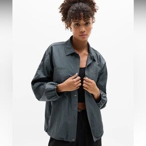 ATHLETA Women's XS Dark Rinse Lunar Sheen Blue Grey Nylon Snap Button Shirt NWOT